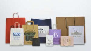 Image showing a variety of paper bags including tape and twist handle bags as well as bespoke luxury paper bags. 