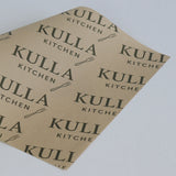 Kulla Kitchen branded paper on a light gray background