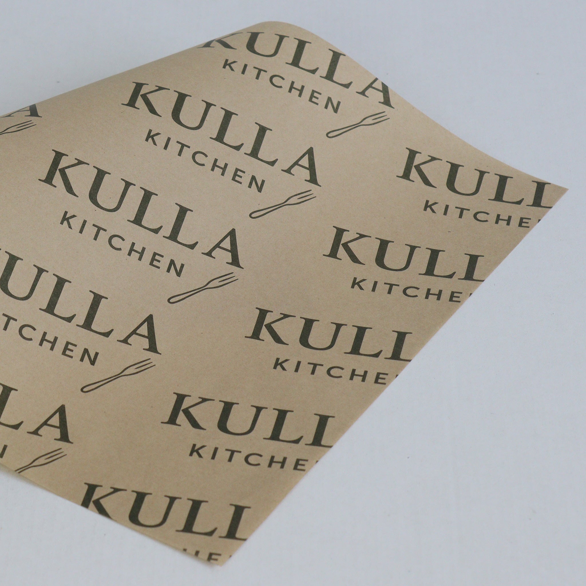 Kulla Kitchen branded paper on a light gray background